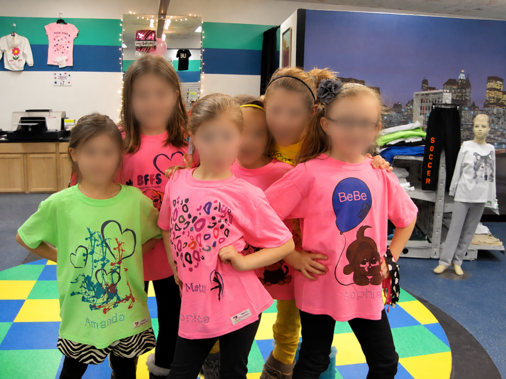 NuWaka party guests wearing the custom shirts they created